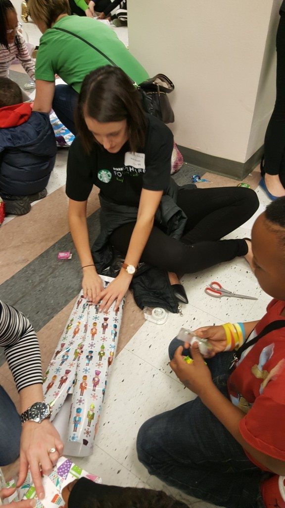 1 - 1 - 20161219_132428 starbucks volunteers helping kids wrap presents